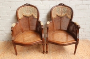 pair cained Louis XVI arm chairs
