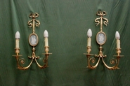 Pair Louis XVI gilded bronze wall sconses with wedegewood panels