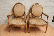 Pair Louis XVI gilt arm chairs