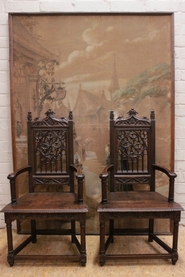 Pair oak gothic arm chairs