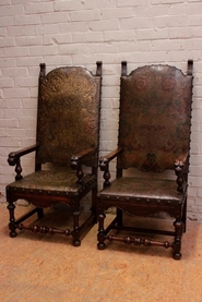 Pair renaissance castlle arm chairs in walnut and Cordoba leather