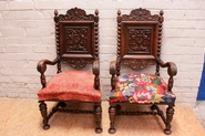 Pair renaissance style arm chairs in oak