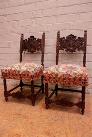Pair renaissance style side chairs in walnut