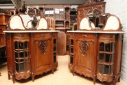 Pair walnut Louis XV bombe cabinets with beveled glass and marble backsplash Signed by Kint Gand