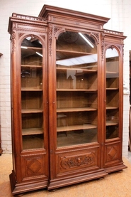Quality 3 door renaissance style bookcase in walnut