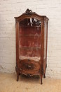 quality Louis XV bombe display cabinet in walnut with gilt accents