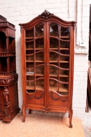 Quality Louis XVI bookcase in walnut with beveled glass