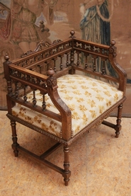 renaissance style arm chair with gilt accents