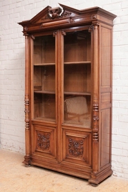 Renaissance style bookcase in walnut signed in the lock