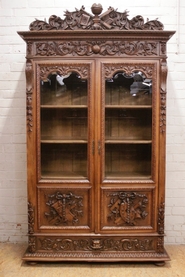 Renaissance style bookcase in walnut with beveled glass