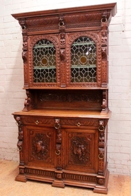 Renaissance style cabinet with stain glass
