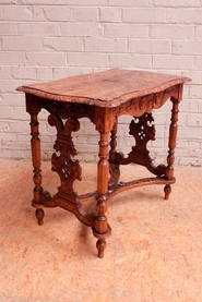 Renaissance style center table in walnut