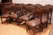 Renaissance style chairs and arm chairs in oak and leather