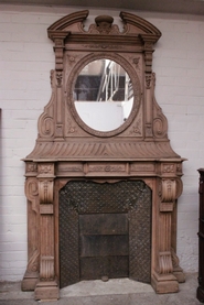 Renaissance style fire mantle in bleached oak