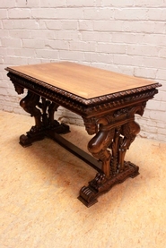 Renaissance style writing table in walnut