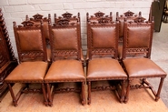 Set of 8 walnut renaissance chairs with different heads 