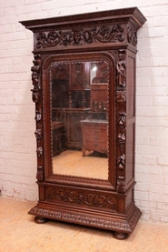 single door figural renaissance style armoire in oak