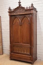 Single door gothic armoire in walnut
