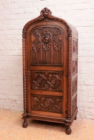 Single door gothic style armoire in walnut