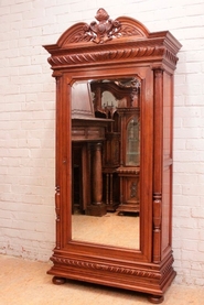 Solid walnut Henri II style armoire with beveled mirror