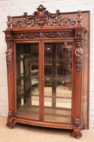 Special renaissance figural display cabinet in oak