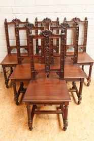 Suite of 6 walnut figural renaissance chairs