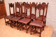 Suite of 8 renaissance chairs in walnut with faces