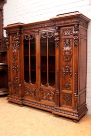 Top quality 4 door renaissance bookcase in walnut signed Lerolle Paris