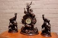 Walnut black forest clock set with glass eyes