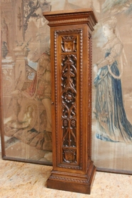 Walnut gothic pedestal with door