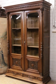Walnut Henr II bookcase with beveled glass