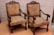 Walnut renaissance style arm chairs