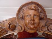 Pair of walnut corner chairs with cherub face 19th century 