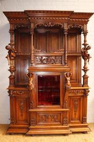 Walnut figural cabinet 19th century