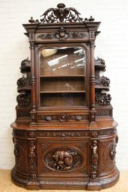 Oak hunt bombay cabinet with cherubs 19th century