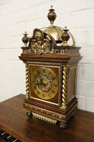 Walnut and bronze clock with angel face 19th century