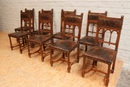 8 walnut Henri II chairs print leather, France 19th century