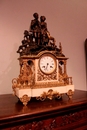 style Clock in bronze and marble, France 19th century