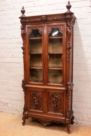 exceptional cherub bookcase in walnut