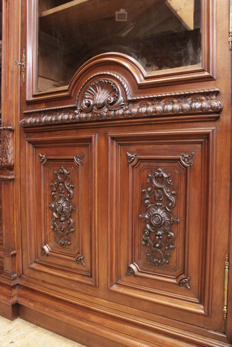 Exceptional monumental regency bookcase in walnut