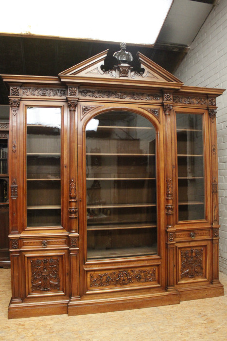 Exceptional monumental walnut renaissance bookcase with bronze statue of Doctor Pinard