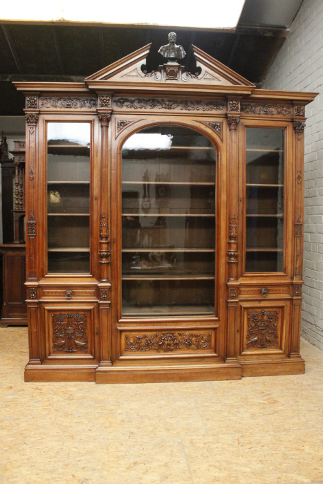 Exceptional monumental walnut renaissance bookcase with bronze statue of Doctor Pinard