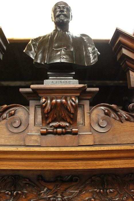 Exceptional monumental walnut renaissance bookcase with bronze statue of Doctor Pinard