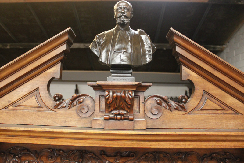 Exceptional monumental walnut renaissance bookcase with bronze statue of Doctor Pinard