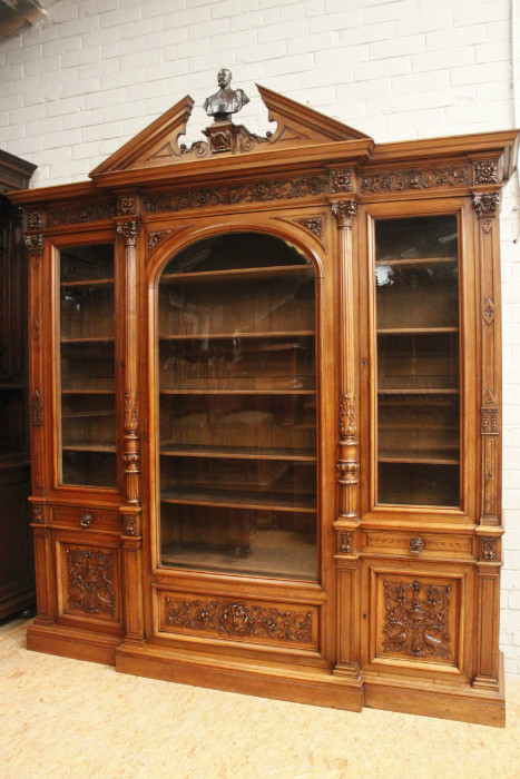 Exceptional monumental walnut renaissance bookcase with bronze statue of Doctor Pinard