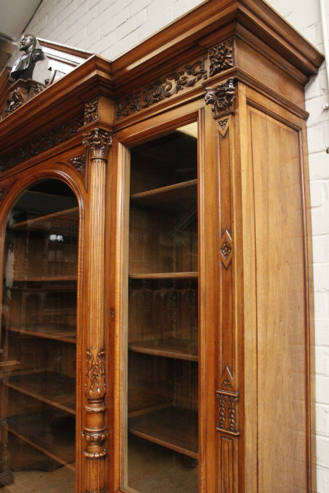 Exceptional monumental walnut renaissance bookcase with bronze statue of Doctor Pinard