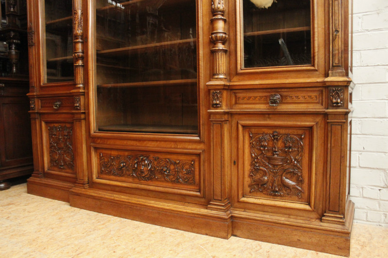 Exceptional monumental walnut renaissance bookcase with bronze statue of Doctor Pinard