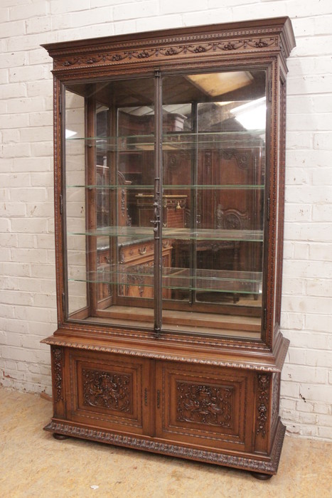 Exceptional renaissance showcase in walnut with iron doors