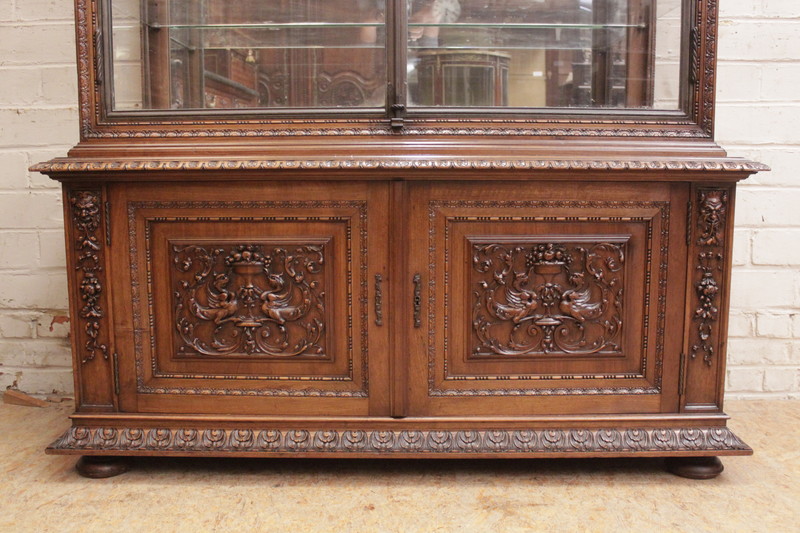 Exceptional renaissance showcase in walnut with iron doors