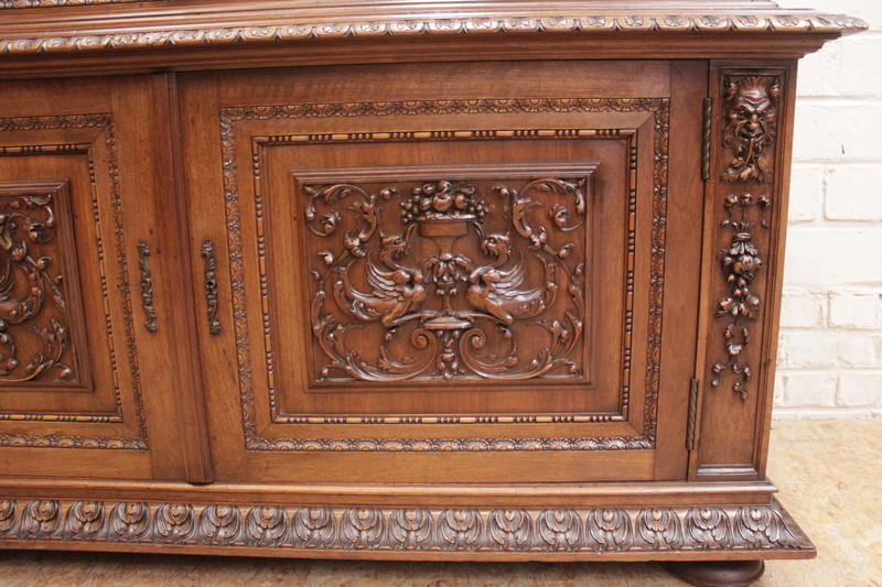 Exceptional renaissance showcase in walnut with iron doors